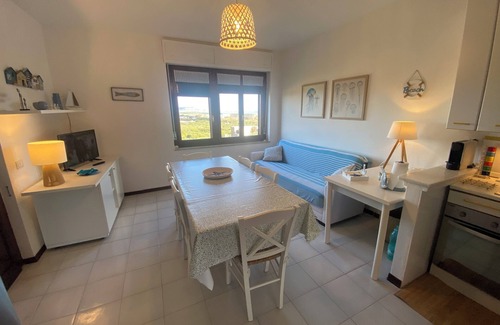 La Pelosa Apartment | Stintino: house with sea view, garden, Wi-Fi, air conditioning and mosquito nets