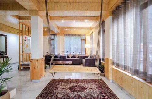 Manali Ski Chalet | Stone and wood cosy chalet admist apple garden with a beautiful law
