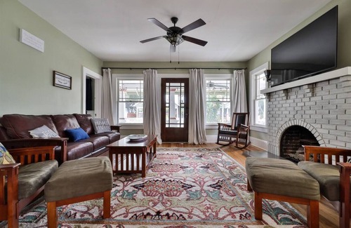 Historic District House | Storybook home with wrap around porch and deck