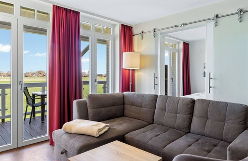Wremen Apartment | Strandnahe Ferienwohnung mit Sauna, Tollem Balkon mit Strandkorb und Landblick
