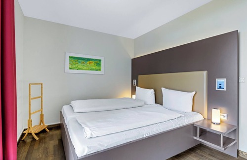 Wremen Apartment | Strandnahe Ferienwohnung mit Sauna, Tollem Balkon mit Strandkorb und Landblick