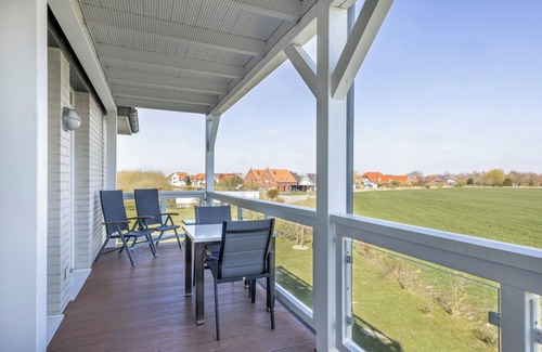 Wremen Apartment | Strandnahe Ferienwohnung mit Sauna, Tollem Balkon mit Strandkorb und Landblick