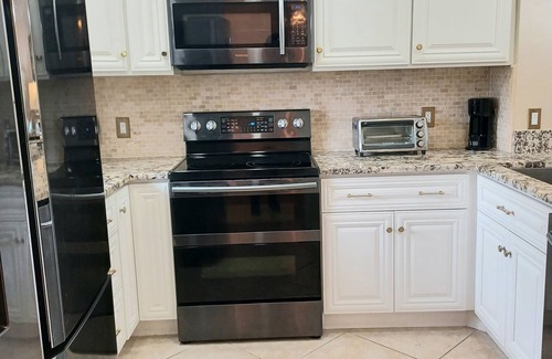Central Naples Condo | Stunning Condo in Naples Bath & Tennis-Lake Views-Pool & Hot Tub-Great Location!
