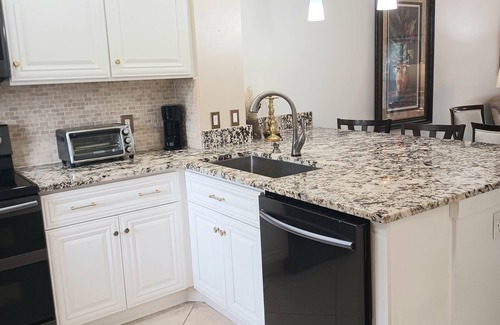 Central Naples Condo | Stunning Condo in Naples Bath & Tennis-Lake Views-Pool & Hot Tub-Great Location!