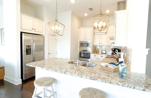 Panama City Beach Condo | Stunning Condo in the heart of 30a! Beautiful decor, Resort pool, four bikes!