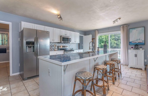 Huddleston House | Stunning Lake Home with Private Dock, Spa, Fire Pit