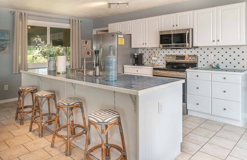 Huddleston House | Stunning Lake Home with Private Dock, Spa, Fire Pit