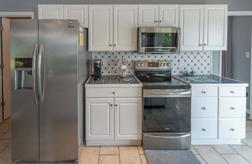 Huddleston House | Stunning Lake Home with Private Dock, Spa, Fire Pit