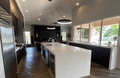 Val Vista Lakes House | Stunning lake view home with oversized jetted spa