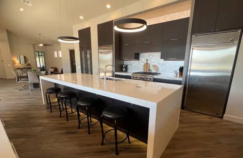 Val Vista Lakes House | Stunning lake view home with oversized jetted spa