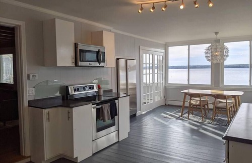 Dedham Cottage | Stunning lakefront home with 270° water views and private beach near Acadia