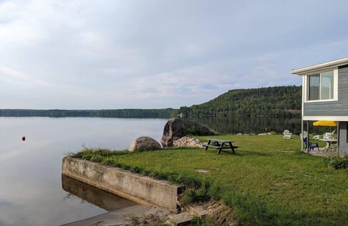 Dedham Cottage | Stunning lakefront home with 270° water views and private beach near Acadia