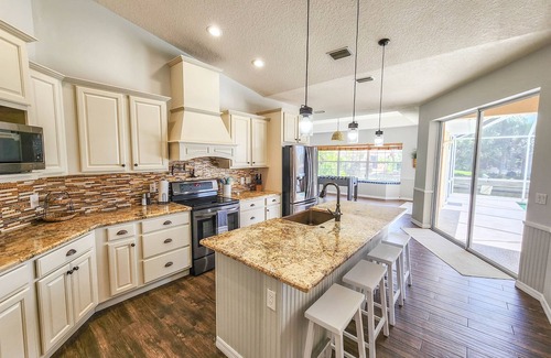 Palm Harbor House | Stunning Pool Home~Boat Dock~Game Room~King Beds