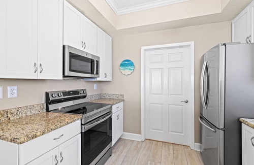 Navarre Beach Condo | Stunning Regency end unit with beach service!
