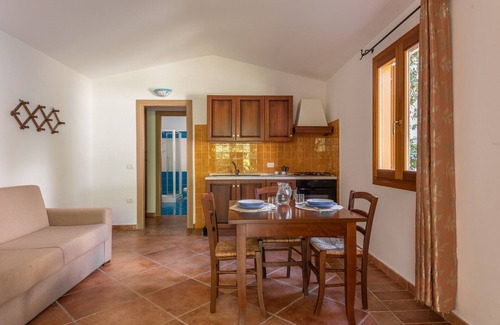 Tanaunella Apartment | Stunning Residence Bouganvillage Studio sleeps 2 plus child bed