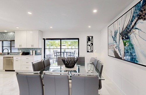 Coral Ridge Isles House | Stunning single level home with, heated pool, kitchen, & fully equipped BBQ area
