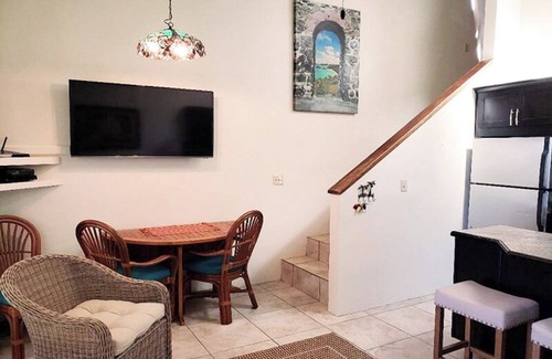 Estate Enighed Condo | Stunning Sunsets, Modern A/C, & Updated Living – Your Dream Condo Awaits!