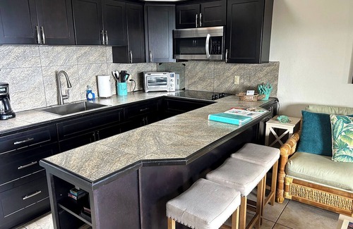 Estate Enighed Condo | Stunning Sunsets, Modern A/C, & Updated Living – Your Dream Condo Awaits!