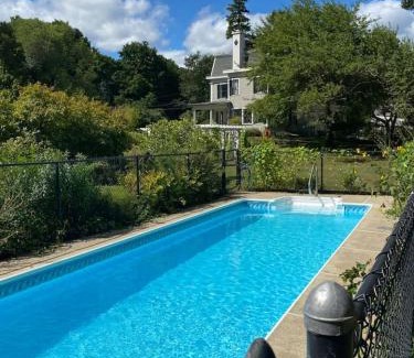 Byfield House | Stunning Victorian Estate with Lap Pool Gardens and Huge Porch