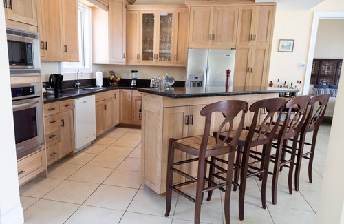 Dunmore Town House | Stunning waterfront property with panoramic sunset views + pool + dock