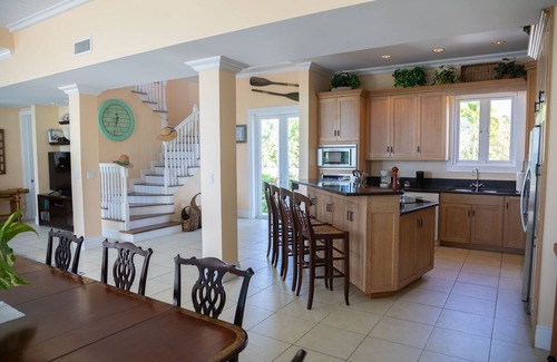 Dunmore Town House | Stunning waterfront property with panoramic sunset views + pool + dock