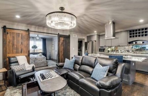 Peak's Suburban Addition Condo | Stylish 1BR furnished condo in Central Dallas with high-end kitchen, Nespresso coffee, 65” smart TV, king bed with premium mattress, and award-winning courtyard retreat.