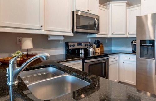 Central Business District Apartment | *Stylish 1BR Getaway w/KING Bed + Patio + Wi-Fi