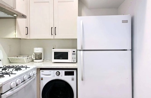 East Flushing House | Stylish 3-bedroom House with Skylight and Access to Rooftop Deck and Patio