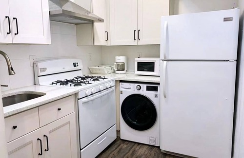 East Flushing House | Stylish 3-bedroom House with Skylight and Access to Rooftop Deck and Patio