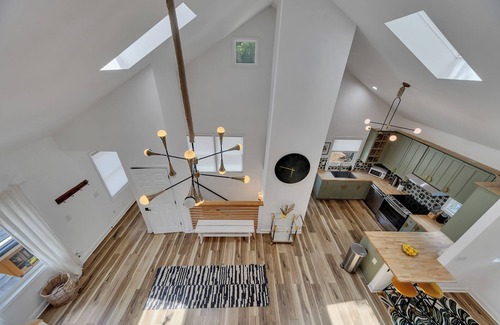 Inman Park Apartment | Stylish 3BR/3BA upper unit in fully remodeled 1920s duplex. Vaulted ceilings, updated kitchen, smart TVs, and private balcony. Perfect for families or groups in walkable Inman Park near BeltLine, dining, and MARTA.