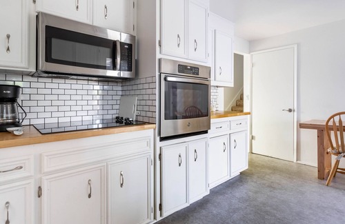West End House | Stylish and Sunny Modern Oasis | Backyard | Grill