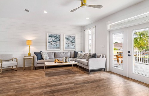 Siguenza Cove House | Stylish canal-front home with game room, firepit, fireplace, W/D & boat slip