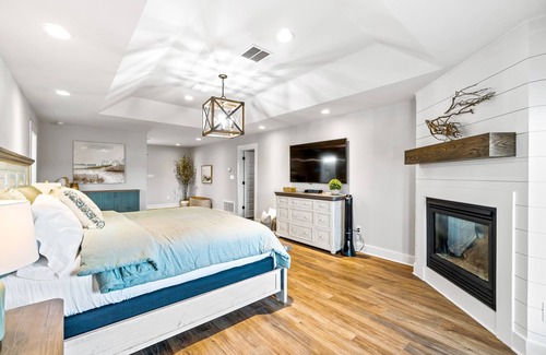 Siguenza Cove House | Stylish canal-front home with game room, firepit, fireplace, W/D & boat slip