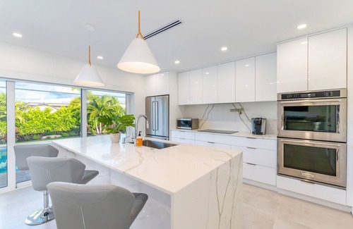 Imperial Point House | Stylish Getaway, Heated Pool, Short Drive to Beach