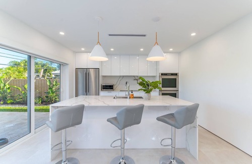Imperial Point House | Stylish Getaway, Heated Pool, Short Drive to Beach