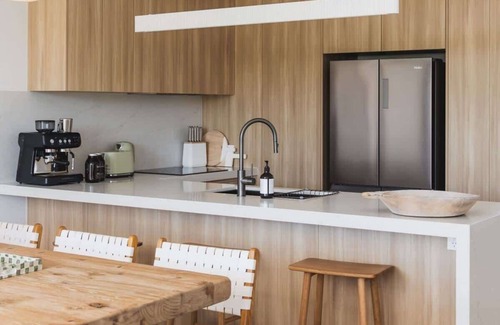 Sunrise Beach House | Stylish home, steps to the beach