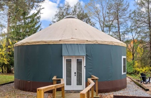 Stanley Cottage | Stylish yurt with luxurious king bed.