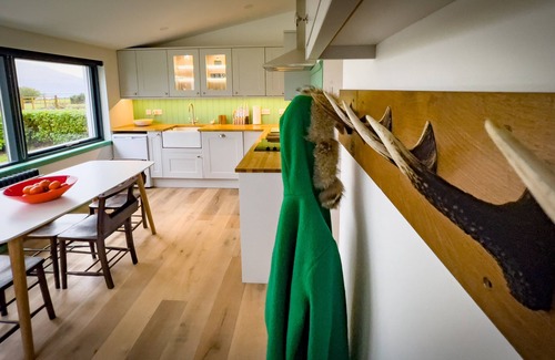 West Laroch Cottage | Stylishly renovated Croft house with uninterrupted views of fields, hills & sea