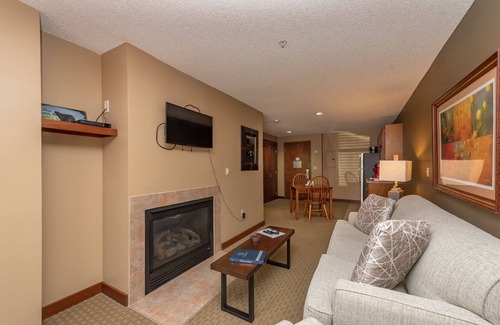 Thayerville Apartment | Suites at Silver Tree A116: 1 bedroom standard view suite with fireplace, kitche