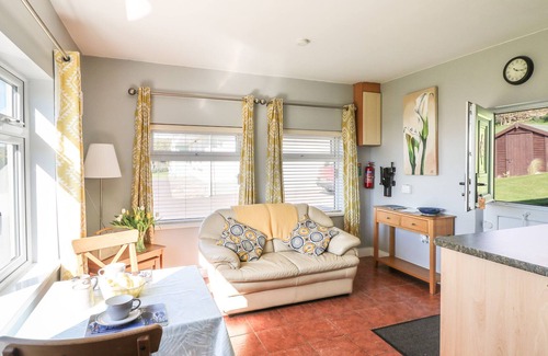 Youghal Apartment | SUMMERFIELD LODGE COTTAGE, with a garden in Youghal, County Cork