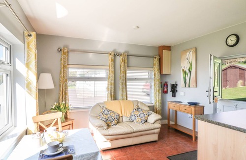 Youghal Apartment | SUMMERFIELD LODGE COTTAGE, with a garden in Youghal, County Cork