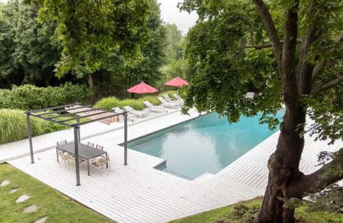 East Hampton House | Summerwood by Rove Travel Home with Pool & Hot Tub