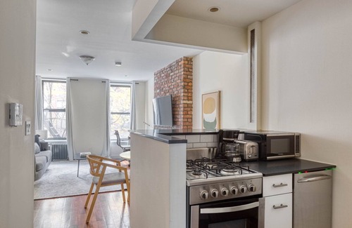 Bowery Apartment | Sunlit East Village 1BR w/W/D, nr First Park, by Blueground