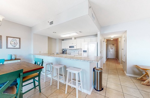 Pensacola Beach Condo | Sunlit & tropical beachfront condo with pool, gym, balcony views