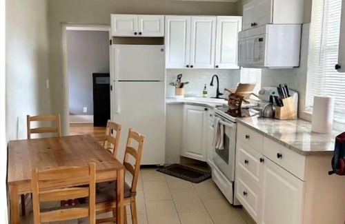 Old Seminole Heights House | Sunny 2 Bedroom Home with Backyard and Front Porch in Seminole Heights