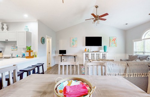 Little River Condo | Sunny condo with pool access, coastal theme, balcony, W/D, and central AC