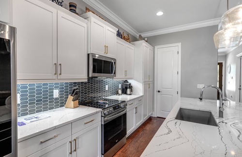 Villa Lago House | Sunny getaway with 2 golf carts, patio, grill, pool, & tennis