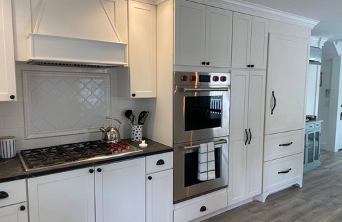 Camden House | Sunny gourmet kitchen lovely gardens near village harbor library restaurants