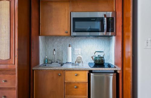Palm Coast Apartment | Sunny Hammock Beach Condo Balcony with Ocean Views!