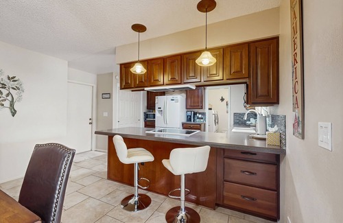 Sunland Village House | Sunny home with covered patio, grill, pool, tennis, hot tub, full kitchen, & AC
